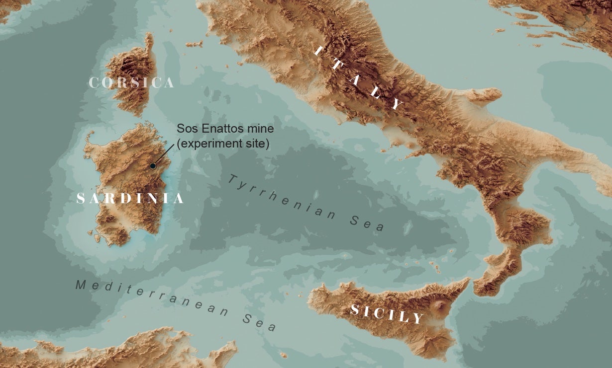Map shows the location of the Sos Enattos mine (experiment site) on the island of Sardinia in the Mediterranean Sea.